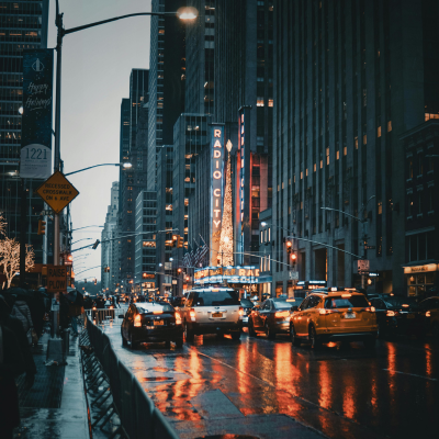 Cars in New York City traffic in the evening